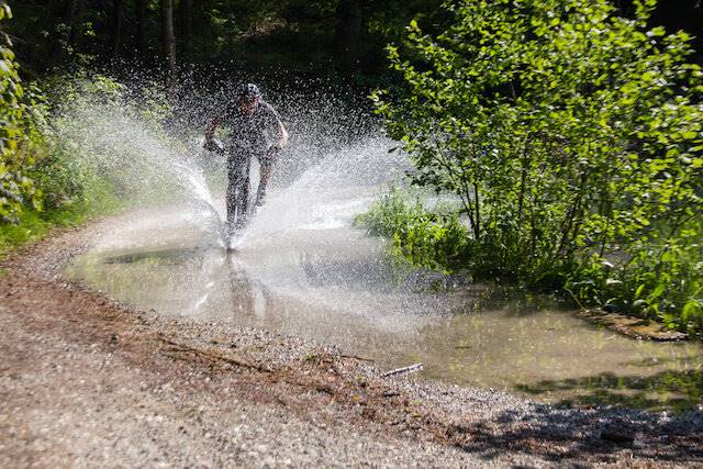 man riding bike puddle wet lube bike chain