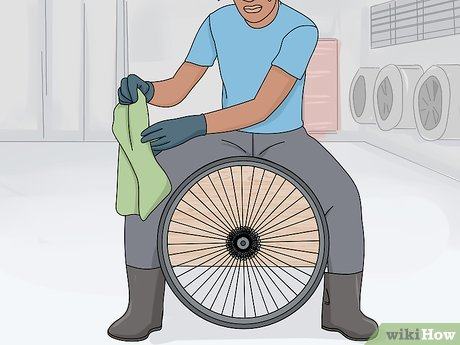 animated person holding the bike wheels clean bike cassete