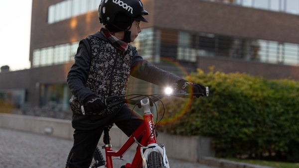 kid riding bike late noon lights reflectors safety tips