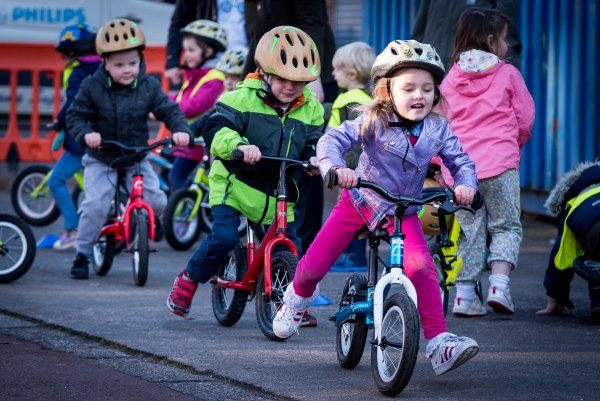 kids with warm clothes riding bike downhill bike safety