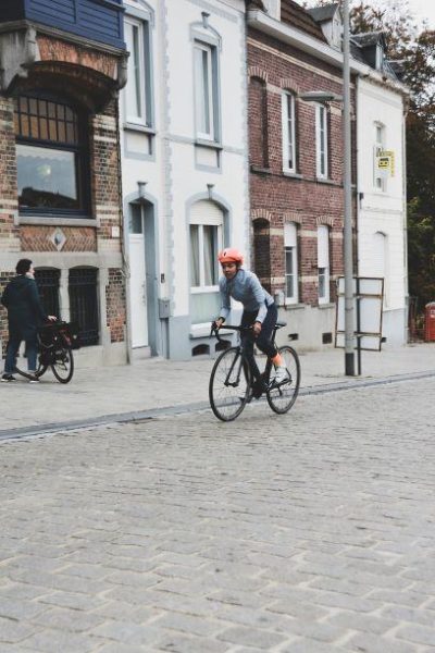 woman cycling on street red helmet